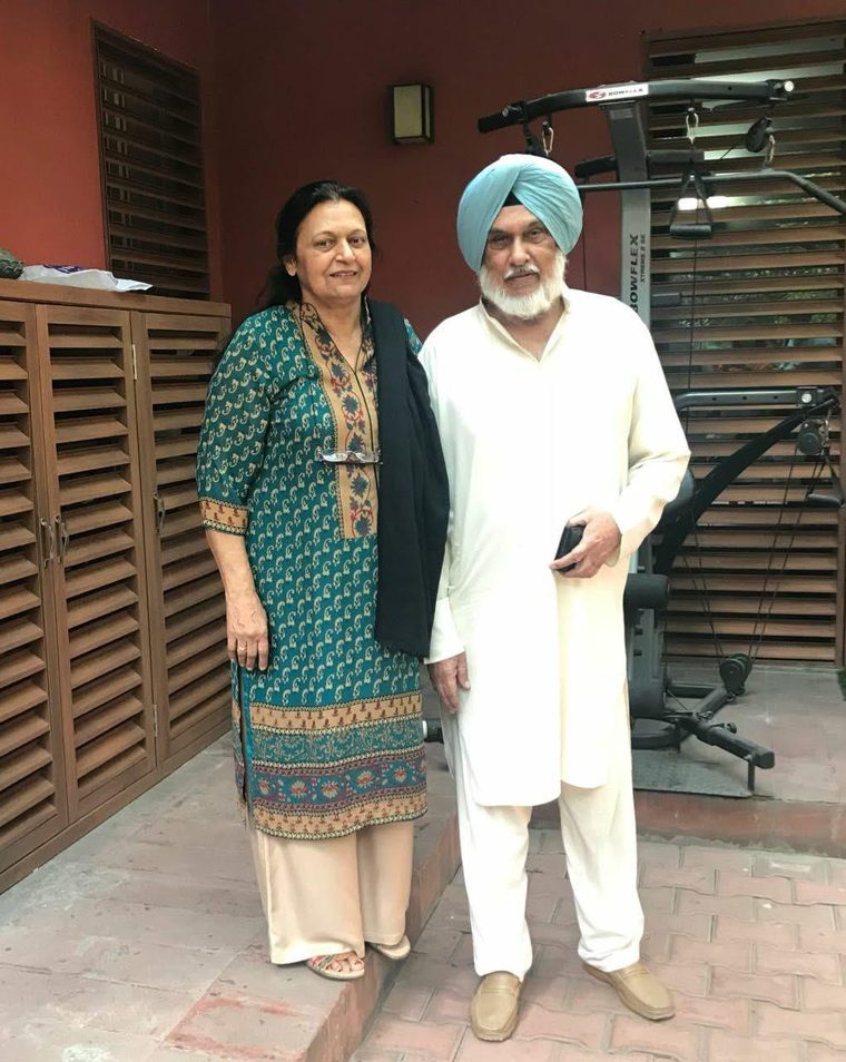 A couple standing together at home